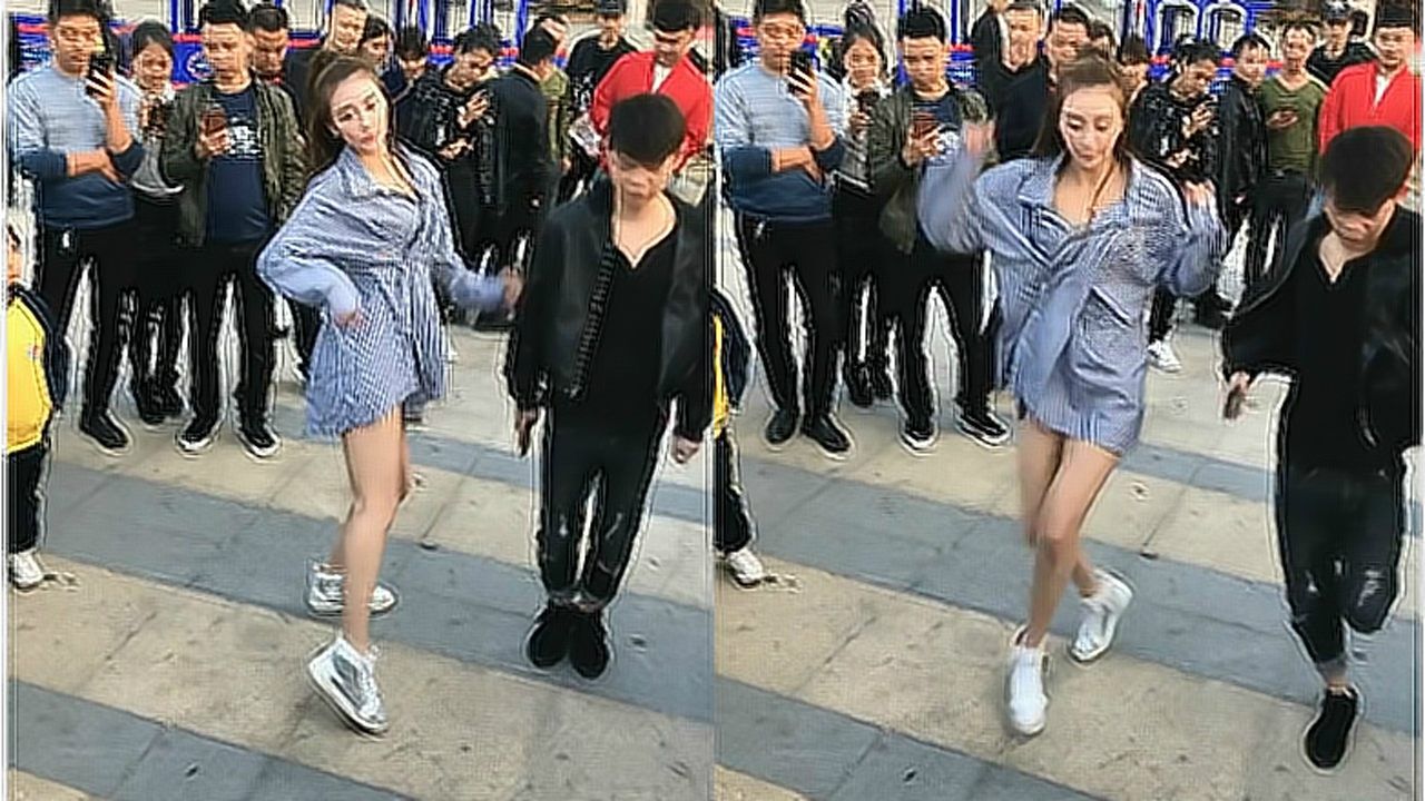 路人围观美女与小伙子广场斗舞,可惜小伙子差太多了!