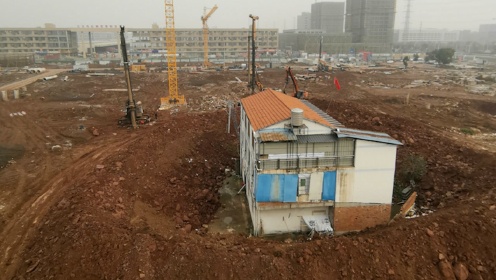 义乌一物流园建设项目被曝“围堵”民宅 运营商为知名民企