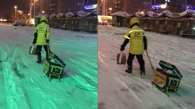 雪天道路结冰,外卖小哥“拉雪橇式”拖餐箱徒步送餐,路人心酸