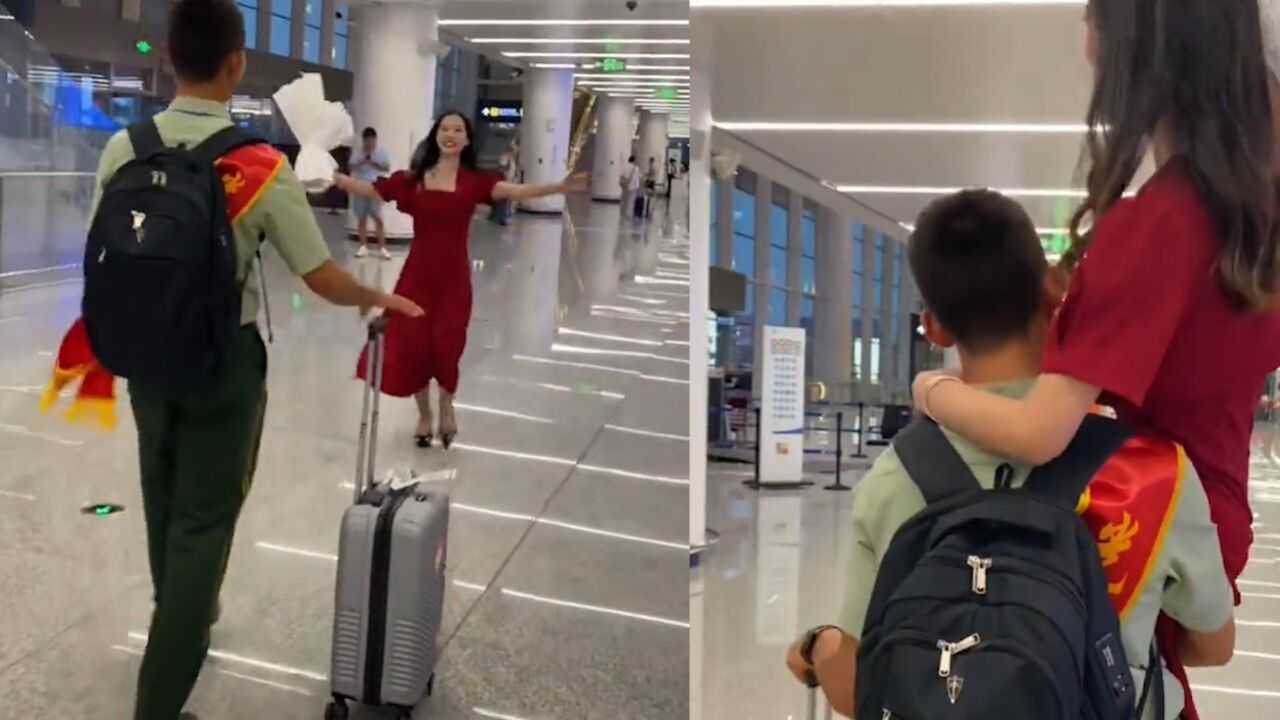 女生身穿红裙迎接退伍男友,男友直接用单手抱起女友:太幸福了_腾讯视频