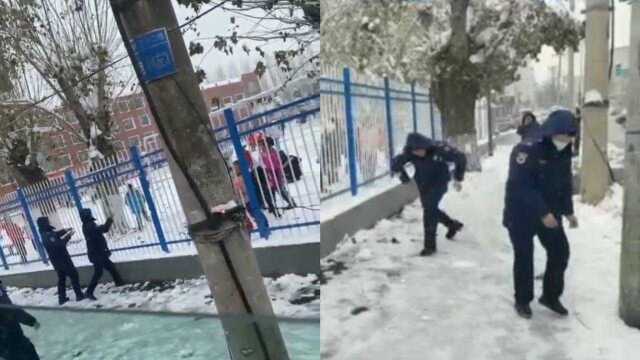 大可爱遇上小可爱!消防员与小学生“大打出手”,互相扔雪球打雪仗!