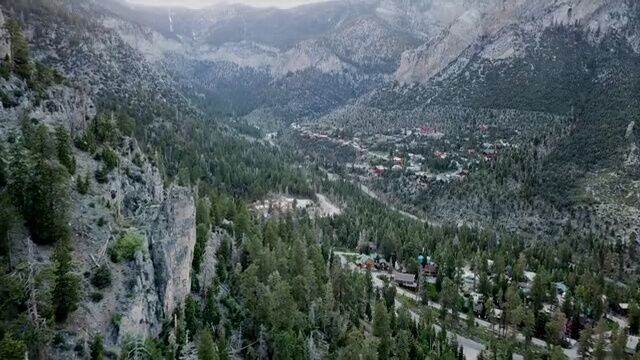 大气的盆地高山森林村落航拍