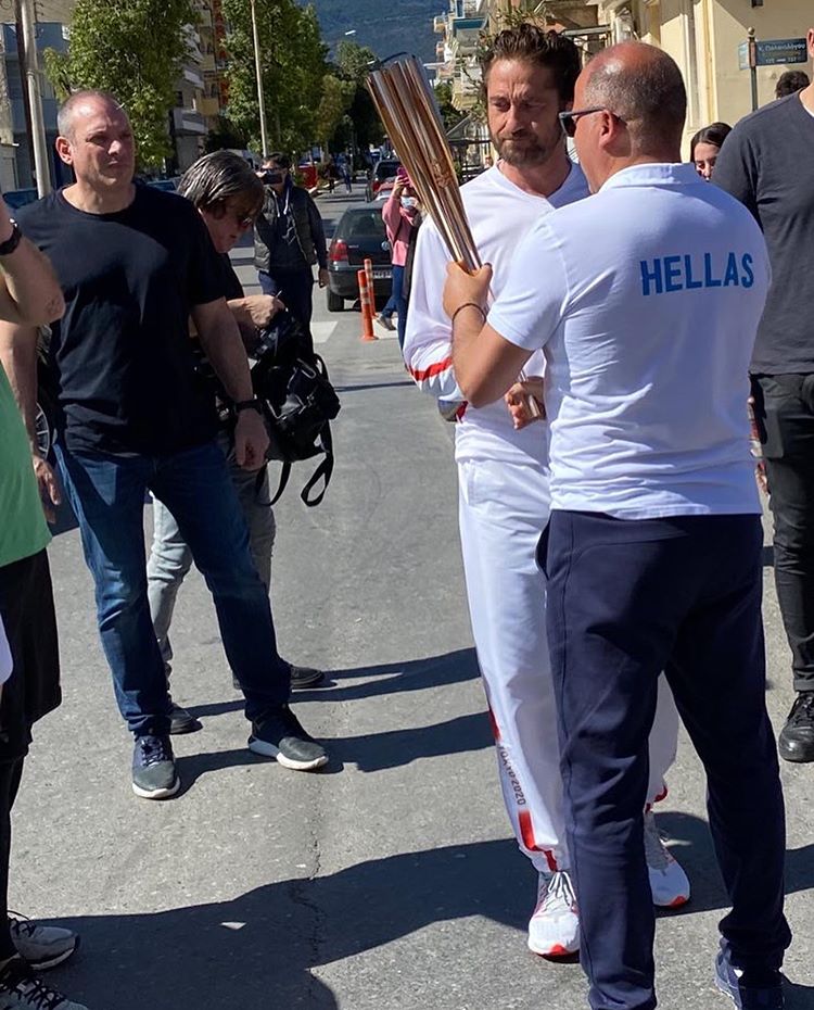 taking pictures of the olympics with the fans.